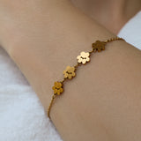 Model wearing Pretty4Paws gold bracelet, a stylish and elegant piece for cat lovers.