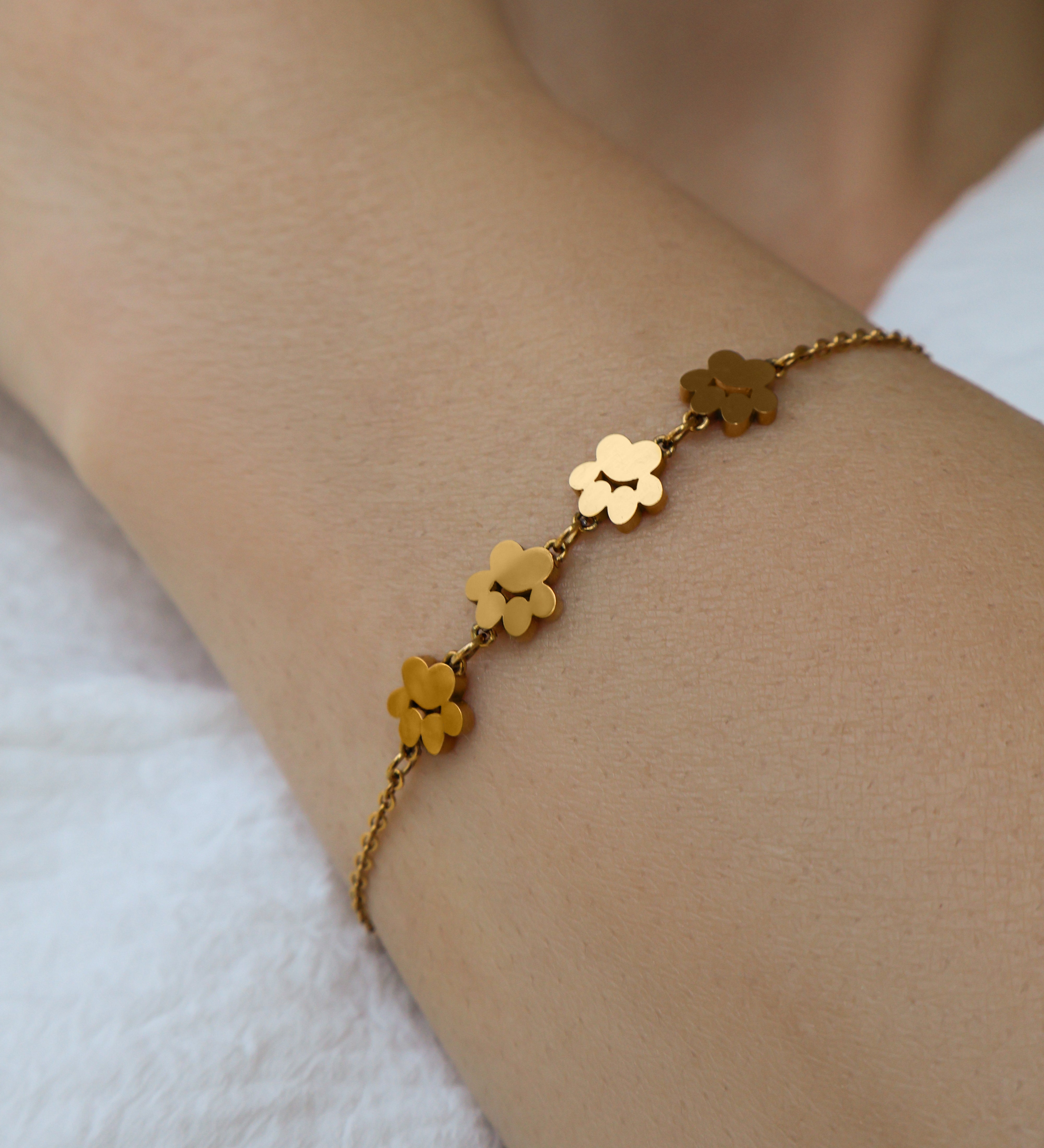 Model wearing Pretty4Paws gold bracelet, a stylish and elegant piece for cat lovers.