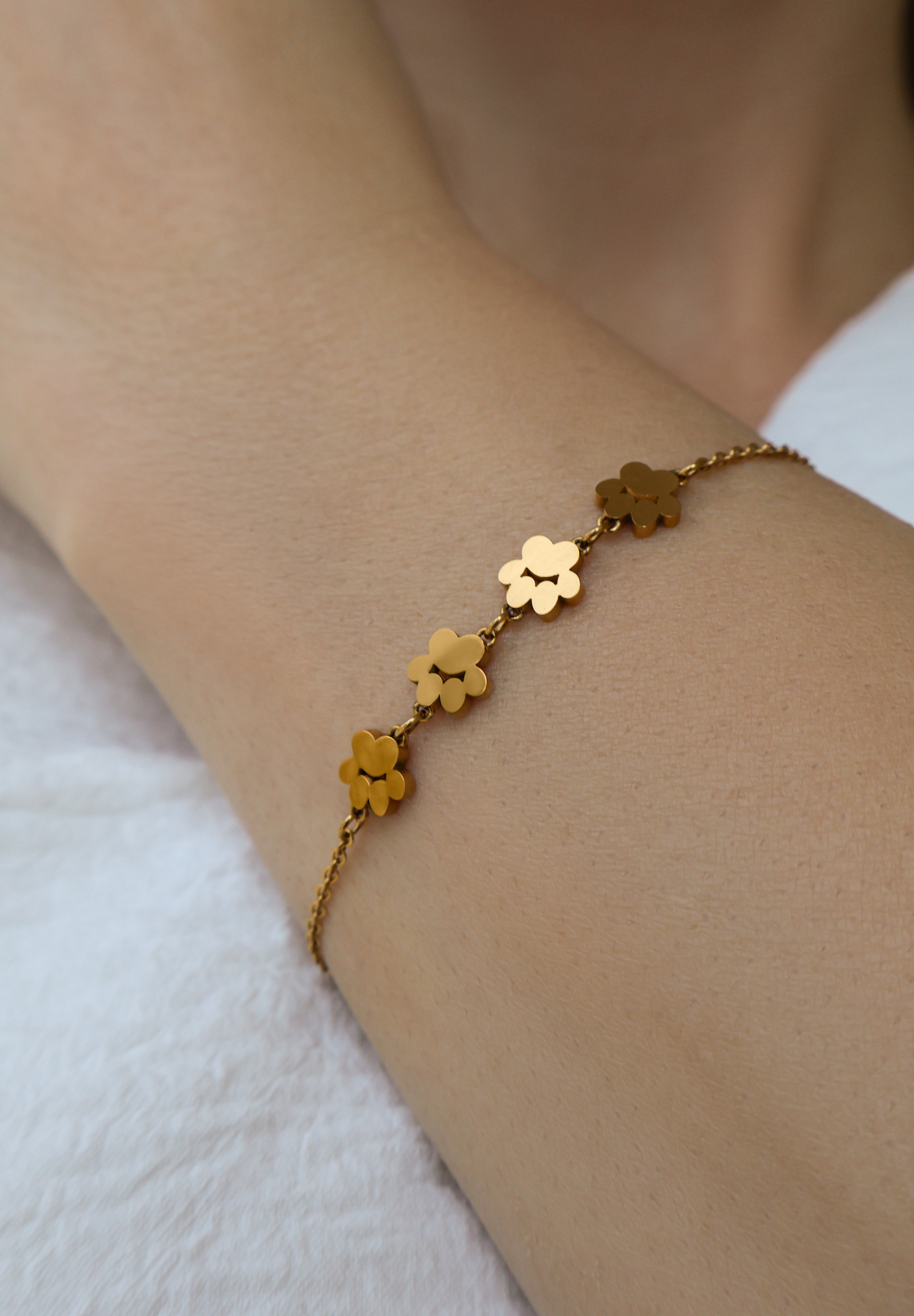 Model wearing Pretty4Paws gold bracelet, a stylish and elegant piece for cat lovers.