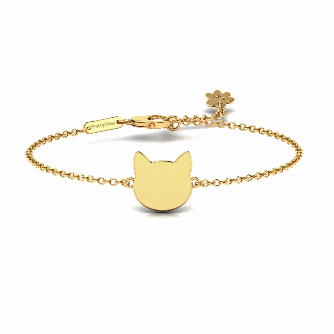 Product image of elegant gold bracelet featuring cat head pendant.