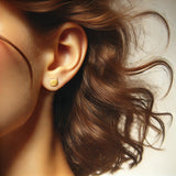 Image showing a model wearing gold cat head stud earring.