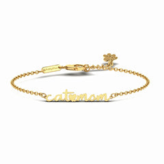 Product image showing a gold bracelet with handwritten-style cat mom pendant.