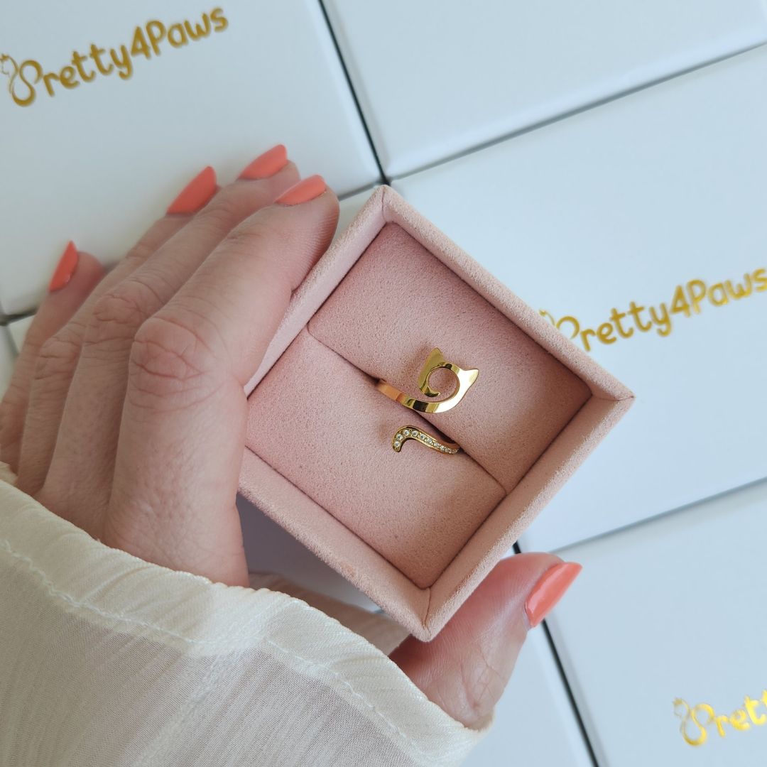Elegant gold-plated cat ring displayed in jewellery box, perfect for cat lovers.