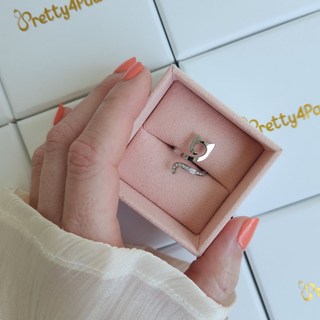 Beautiful silver cat ring decorated with zirconia stones, displayed in elegant jewellery box.
