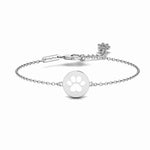 Product image of stainless steel bracelet featuring simple round pendant with paw print in the middle.