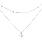Silver-tone double layer cat necklace on white, with sparkling accents on the shorter chain and a round cat-motif pendant below.