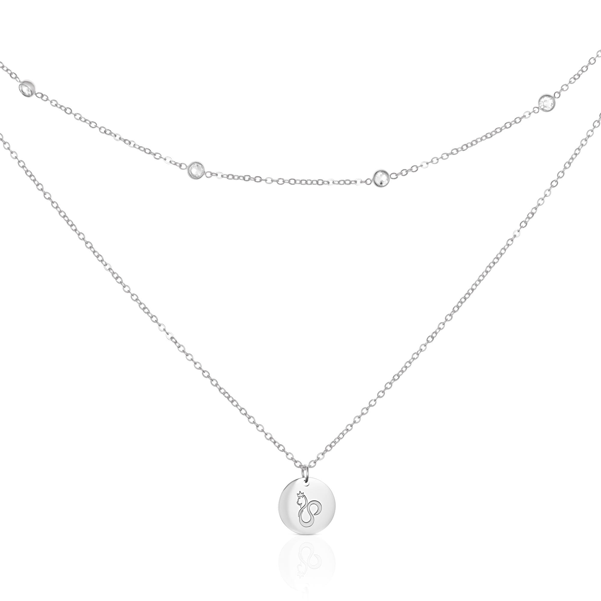 Silver-tone double layer cat necklace on white, with sparkling accents on the shorter chain and a round cat-motif pendant below.