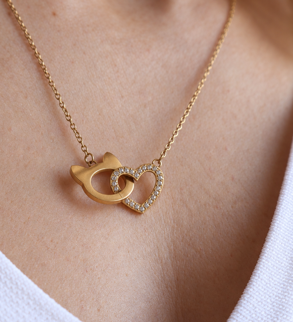 Interlocking Cat Love Necklace featuring a heart linked with the Pretty4Paws signature cat-head shape.