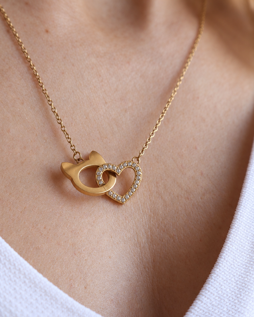 Interlocking Cat Love Necklace featuring a heart linked with the Pretty4Paws signature cat-head shape.