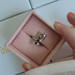 Minimalistic silver cat ring displayed in a luxury jewellery box. 